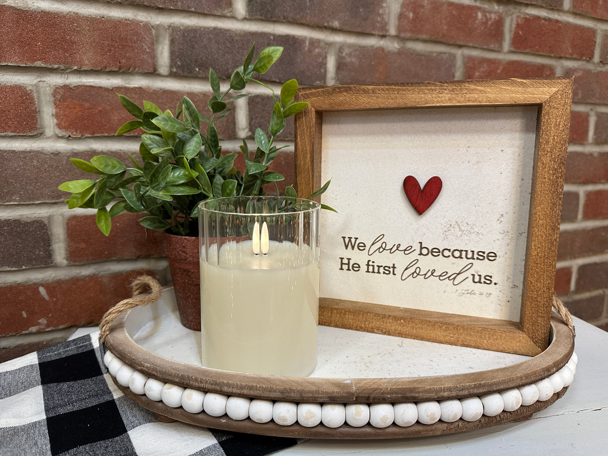 Handmade We Love Because he first loved us framed sign