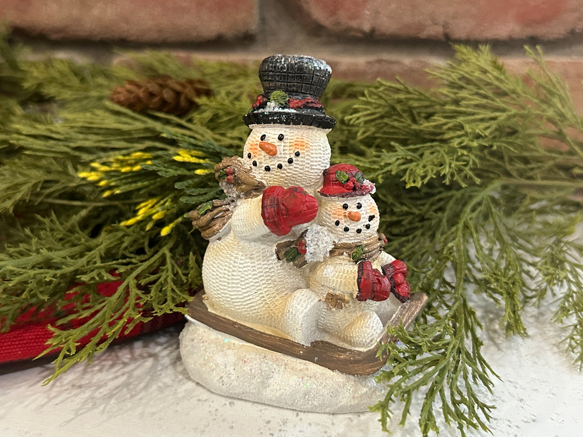 Snowmen on Sled