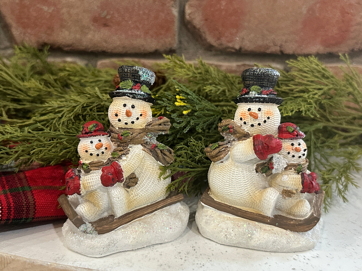 Snowmen on Sled