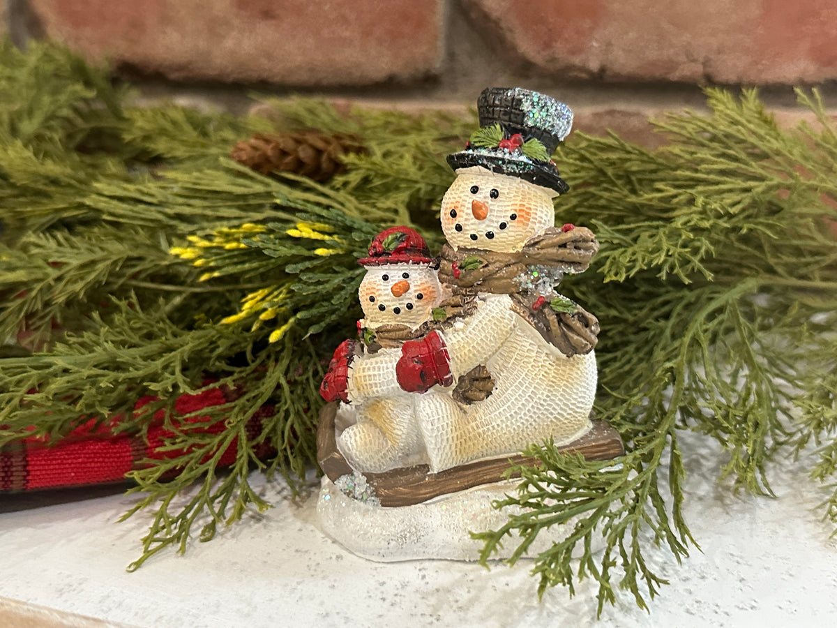 Snowmen on Sled
